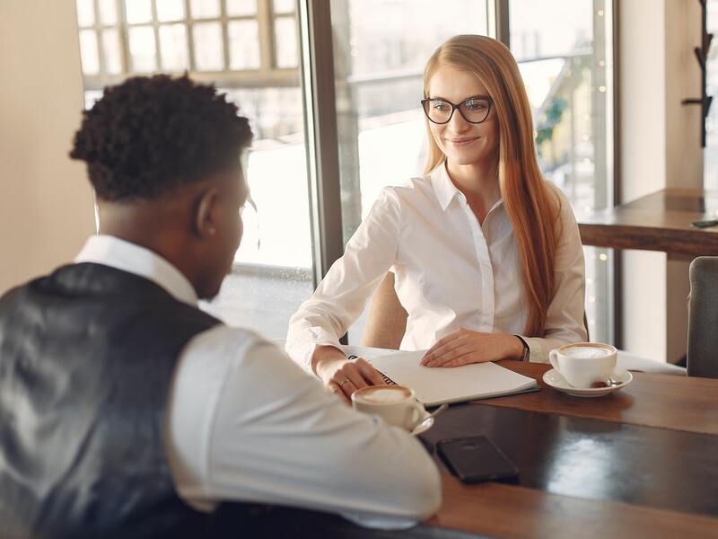 Man Being Interviewed By A Woman 3874035